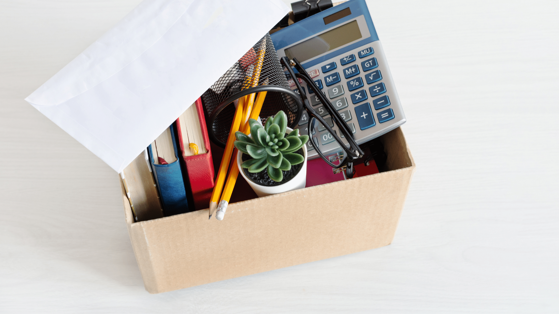 Box filled with office supplies after being fired