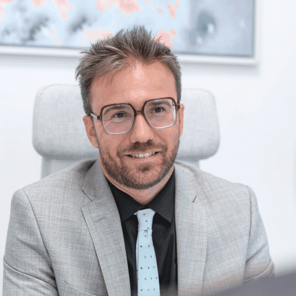 Romain Astruc in suit at meeting